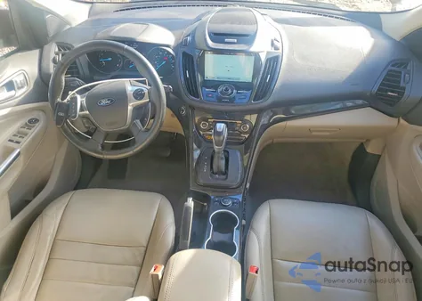 2016 Ford Escape Titanium z USA, uszkodzony, nr VIN 1FMCU9J94GUC83133